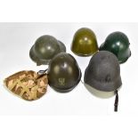 Five military helmets comprising a mid/late 20th century US helmet, Bulgarian Army M36C, a British