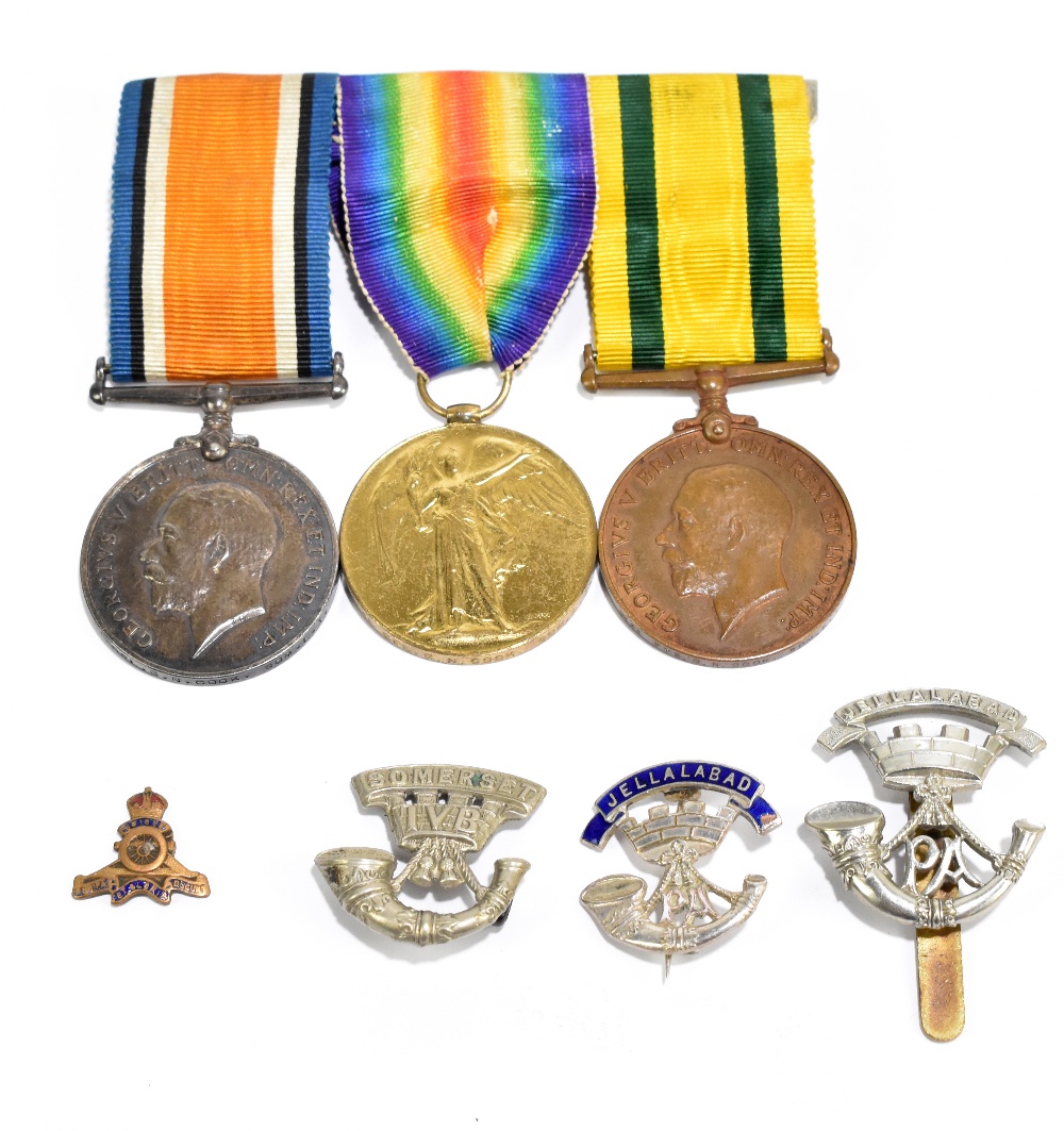 A WWI trio comprising War, Defence and Territorial War Voluntary Service Overseas Medals awarded