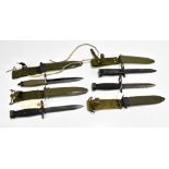 Three US M6, M7 and M8 bayonets and a Norwegian HPK AE3 (first type) bayonet, all with scabbards (