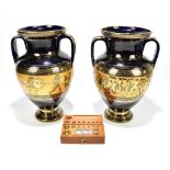 A pair of modern Greek twin handled vases, height 32cm, and a boxed set of modern brass graduated