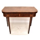 A Georgian inlaid mahogany foldover tea table, raised on tapering block supports, length 95cm,