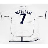 DAVID BECKHAM; an Umbro England 2001-2003 home shirt signed to reverse with 'Beckham 7' printing,