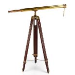 A vintage brass telescope on tripod wooden stand, length of telescope 98cm, height of tripod 94cm.