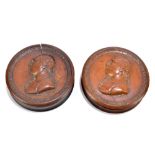 Two 19th century treen snuff boxes of circular form decorated in relief with a bust, inscribed '