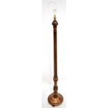 A 20th century beech standard lamp with fluted column, height 154cm.Additional InformationThere is a