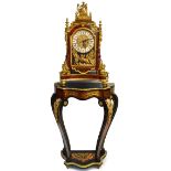 A reproduction Boulle work-style clock raised on serpentine fronted stand the clock with Father Time