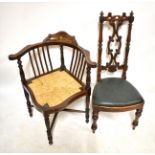 An Edwardian inlaid corner chair with rush seat and a Victorian simulated rosewood side chair with