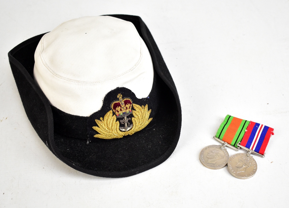 A Women's Royal Naval Service Wren's hat with bullion work crowned fouled anchor device and a WWII