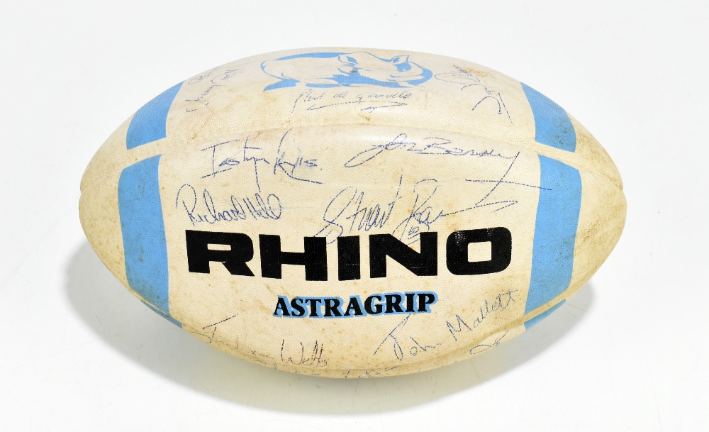 An autographed rugby ball with various signatures to include Richard Hill, Stewart Roy, John Mallet,