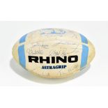 An autographed rugby ball with various signatures to include Richard Hill, Stewart Roy, John Mallet,