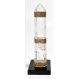 A rock crystal obelisk with three sliver plated mounts, height 27cm.Additional InformationWear and