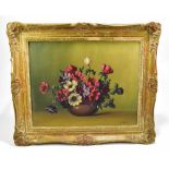 H SHAW; oil on canvas, floral still life, signed lower right, 39 x 49cm, in moulded gilt frame (