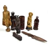 A collection of assorted hardwood, soapstone and gilt wood Sino-Tibetan figures, also a Chinese