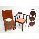 An Edwardian stained beech corner chair, a mahogany three tier folding cake stand and a Victorian