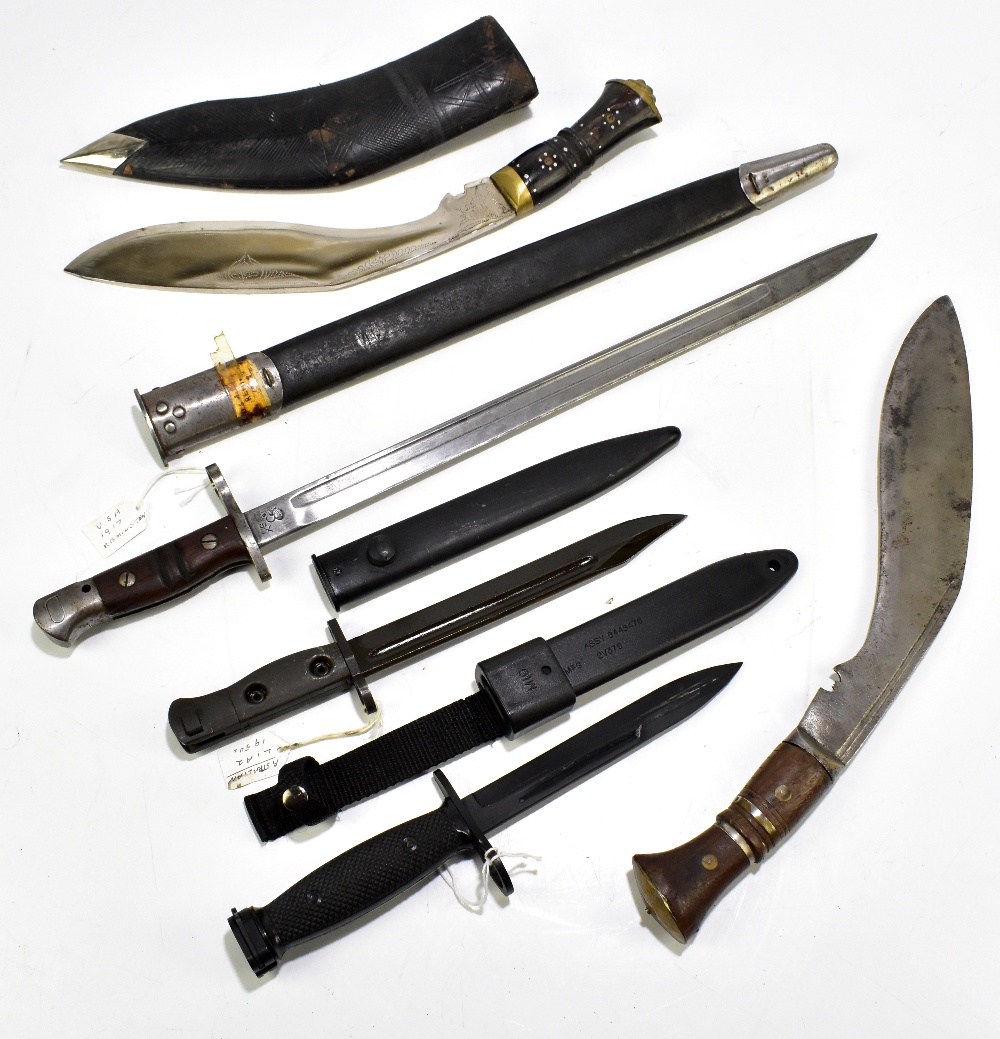 A US 1917 Remington bayonet with scabbard, an Australian L182 c1950s bayonet, both with scabbards, a