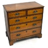 An early 19th century crossbanded mahogany chest of two short and three long drawers, raised on