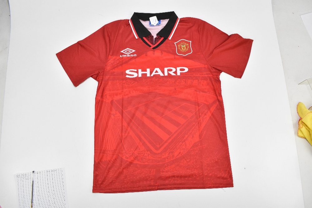MANCHESTER UNITED FC; an Umbro retro-style shirt with embroidered logo signed by Eric Cantona to - Image 2 of 2