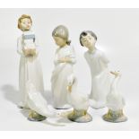 NAO; six assorted ceramic figures including a child holding books, height 30cm (6).Additional