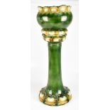 An early/mid-20th century majolica glazed jardinière on stand with leaf moulded decoration on a