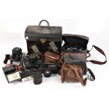 A large quantity of cameras and accessories including a Praktica PL Nova 1B. Footnote: The cameras