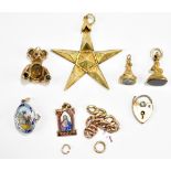 A gold plated Masonic star charm, together with five further plated and white metal charms to