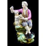 DERBY; an 18th century figure of a gentleman with dancing dog, pseudo blue painted marks to base and