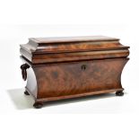 A 19th century mahogany sarcophagus form tea caddy with twin ring handles, on four bun feet, the