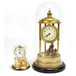 A 19th century brass anniversary clock, the central circular dial with painted detail inside