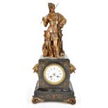 A Victorian slate mantel clock with bronzed spelter surmount of a Grecian soldier, above slate case,