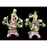 DERBY; a pair of 18th century figures of musicians, he playing the flute, she holding the flute,