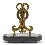 A miniature brass skeleton clock, the silvered dial set with Roman numerals below fleur de lis