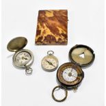 A late 19th century tortoiseshell card case, 10 x 7cm, also three compasses including two military