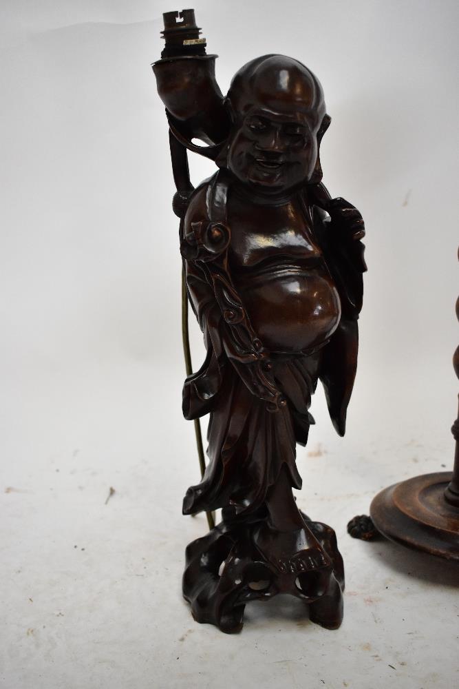 An Eastern carved hardwood lamp base modelled as the Buddha, height including fitment 49cm, a - Image 2 of 3