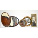 An Edwardian inlaid mahogany oval wall mirror with bevelled plate, length 80cm, together with a