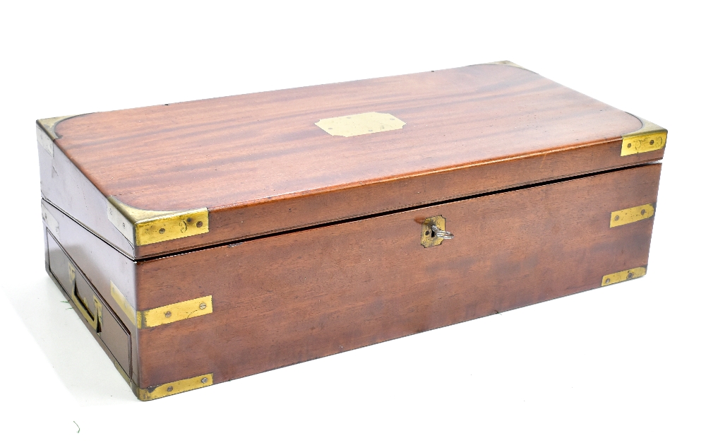 A mahogany and brass bound writing slope with campaign-style handles and drawer to left side, the