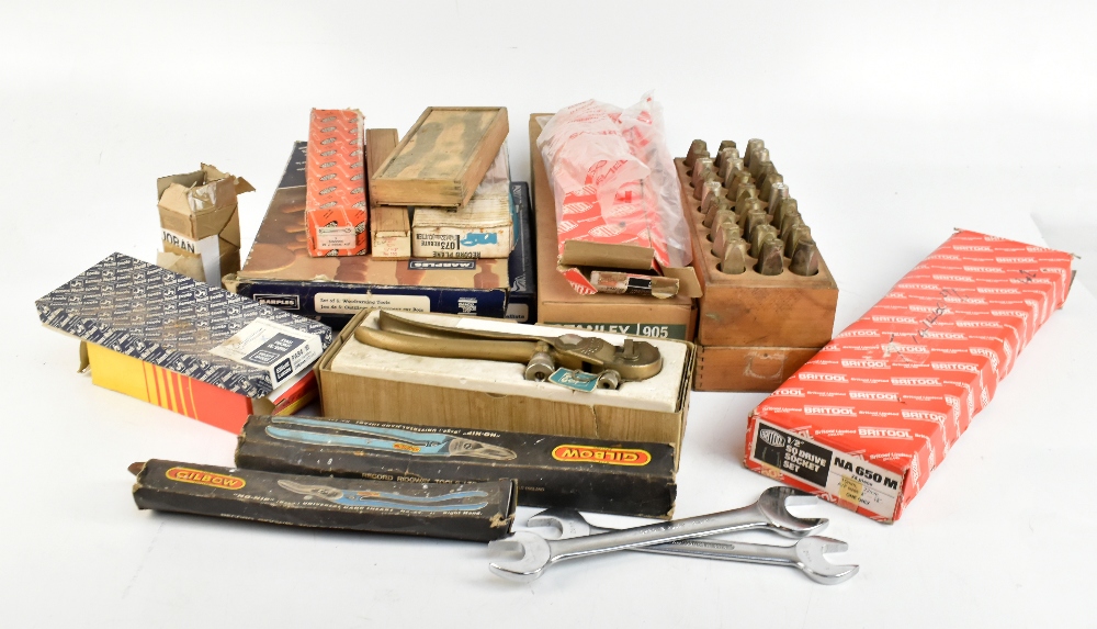 An assortment of various tools including a boxed Stanley brace, Eclipse saw set, a cased set of