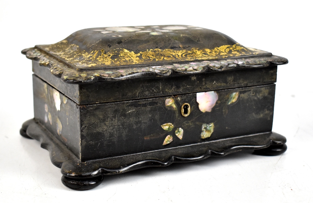 A Victorian papier-mâché work box with mother of pearl inlay and gilt scrolling decoration, width