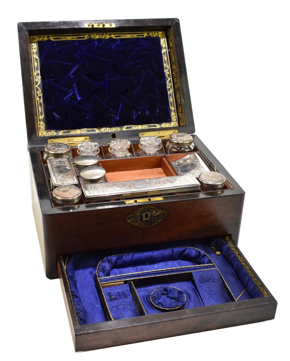 A Victorian rosewood travelling vanity set, the hinged cover with mother of pearl inlaid