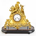 A 19th century French gilt spelter mantel clock with applied fisherman surmount above a circular