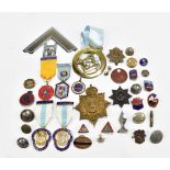 A collection of assorted badges, buttons and masonic jewells, including railway service badge,