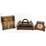 A Victorian walnut and ebonised ink stand with twin clear glass inkwells, width 30cm, a tabletop