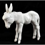 MEISSEN; a blanc de chine model of a standing donkey, painted marks to base, length 11cm.