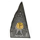 JAMES F MORGAN; a contemporary Welsh slate mantel clock of triangular form, with carved Celtic knots