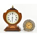 An Edwardian walnut and inlaid mantel time piece with white enamel dial, set with Roman numerals and