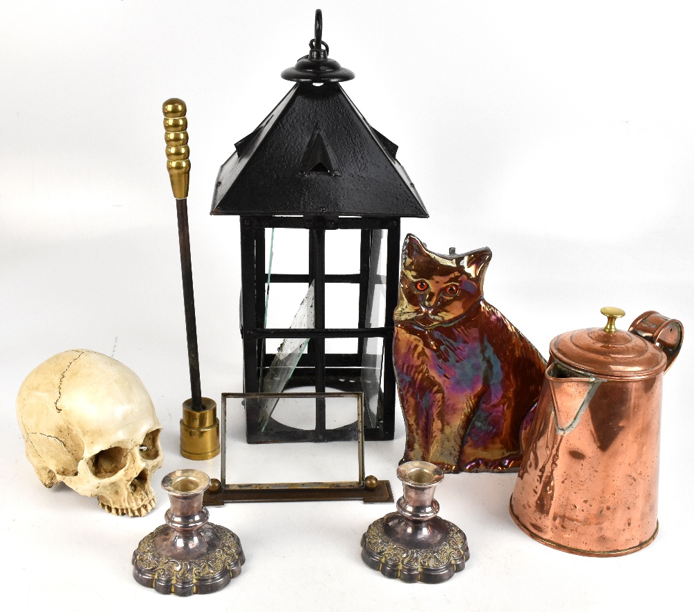 A group of collectors' items including a glazed black painted lantern, height 49cm, a resin skull, a