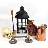 A group of collectors' items including a glazed black painted lantern, height 49cm, a resin skull, a