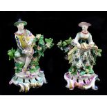 BOW; a pair of 18th century figures of musicians, she playing the hurdy gurdy, he bagpipes, both