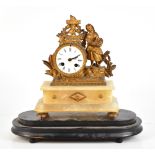 A 19th century French mantel clock with gilt spelter surmount depicting a fruit seller beside