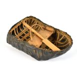 An unusual and well detailed model of a coracle, complete with augur and priest, 18 x 12cm.