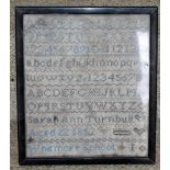 A small mid-19th century alphabet sampler 'Sarah Ann Turnbull, age 12, 1852, Whitmore School', 23